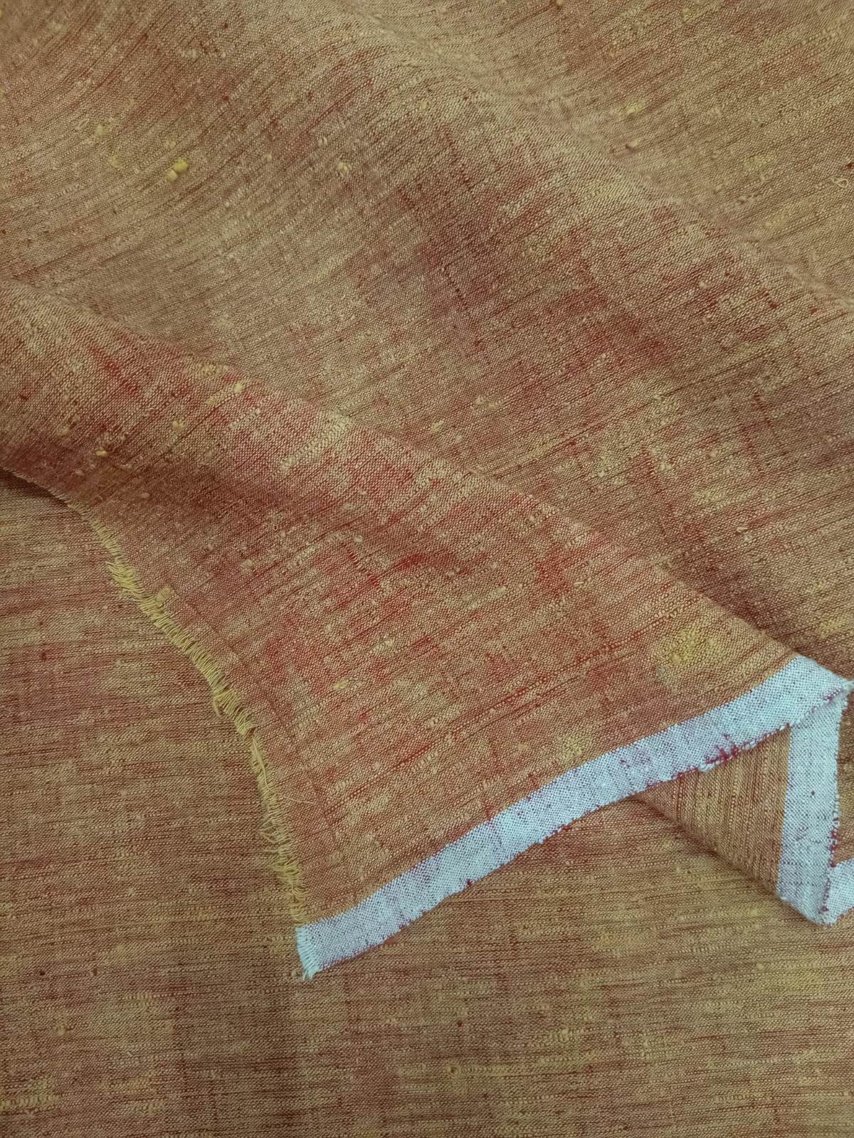 Close-up of brown fabric with a white border