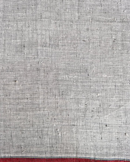 Textured gray fabric with a red stripe at the bottom