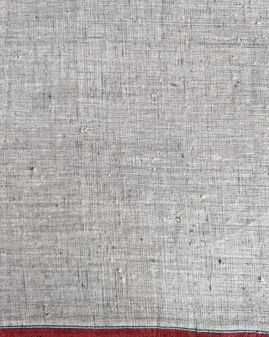 Textured gray fabric with a red stripe at the bottom