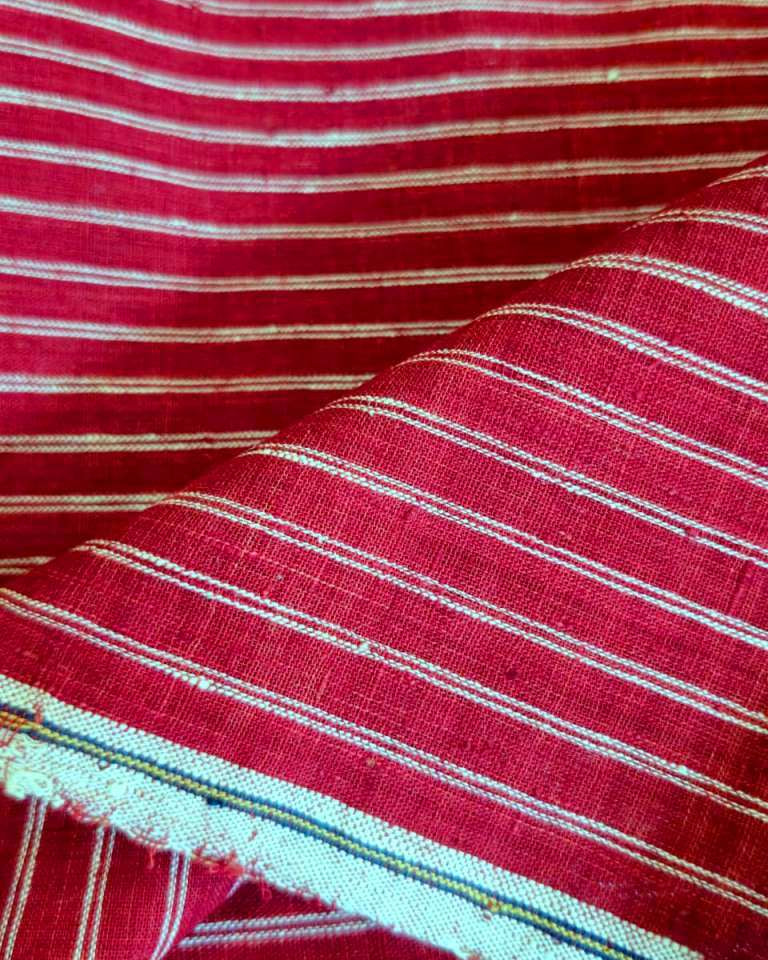 Close-up of red and white striped fabric with visible texture