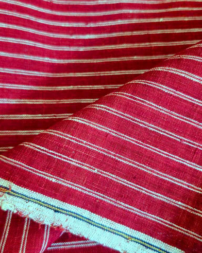 Close-up of red and white striped fabric with visible texture