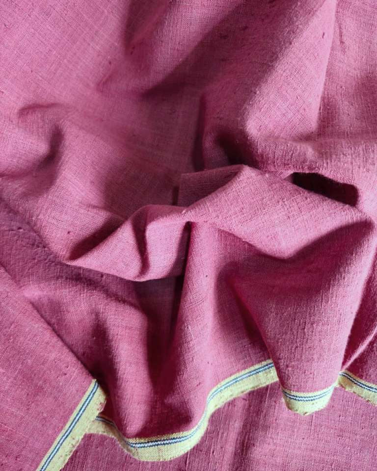 Close-up of pink fabric with a textured surface