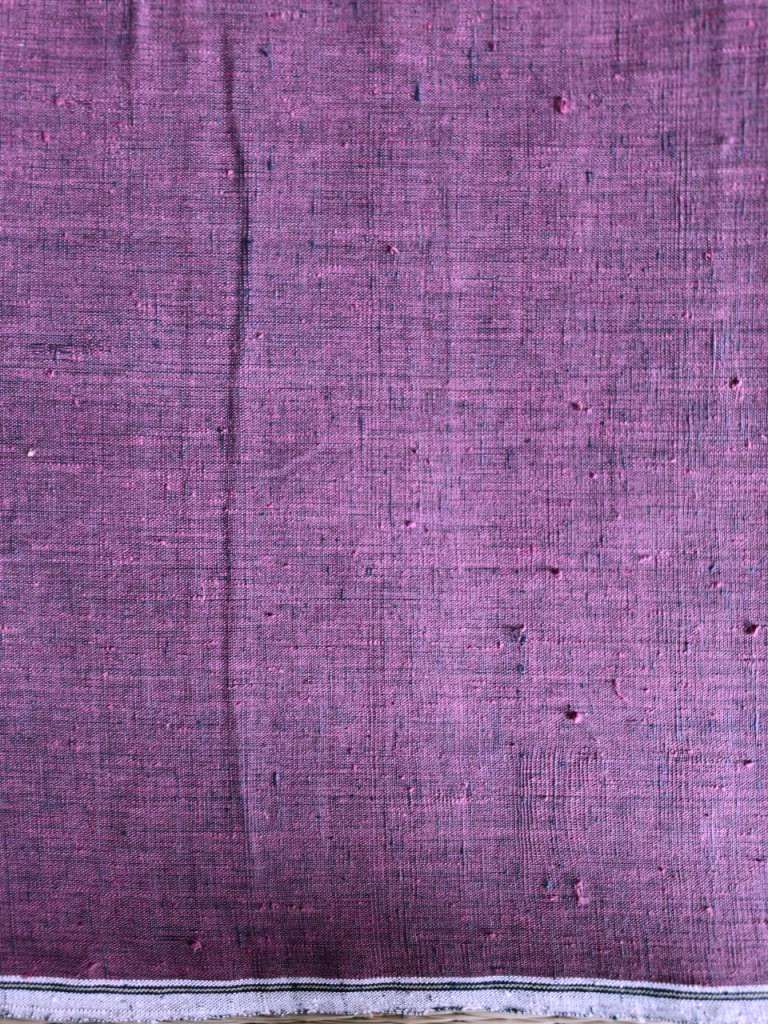 Close-up of purple fabric with a subtle pattern