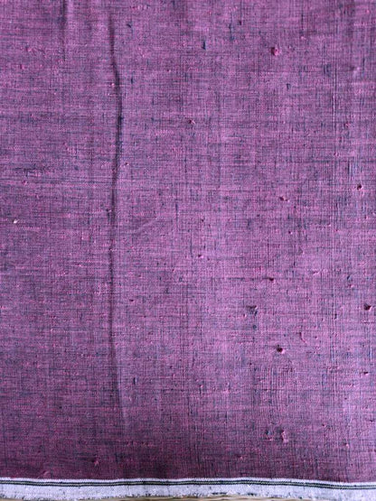 Close-up of purple fabric with a subtle pattern