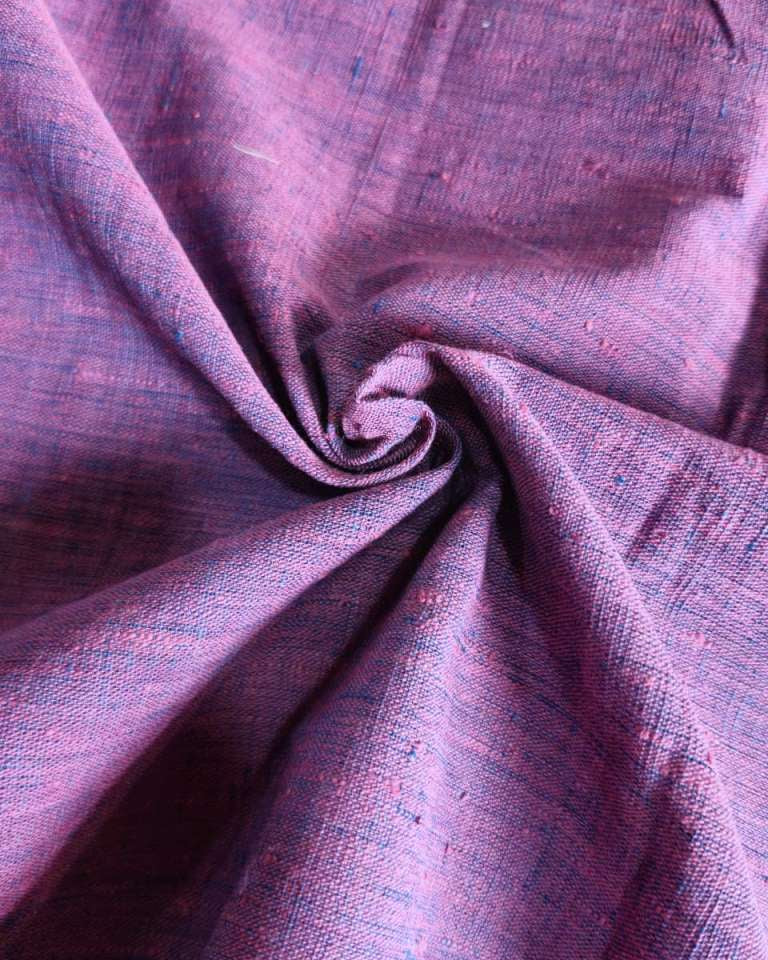 Close-up of purple fabric with a textured pattern