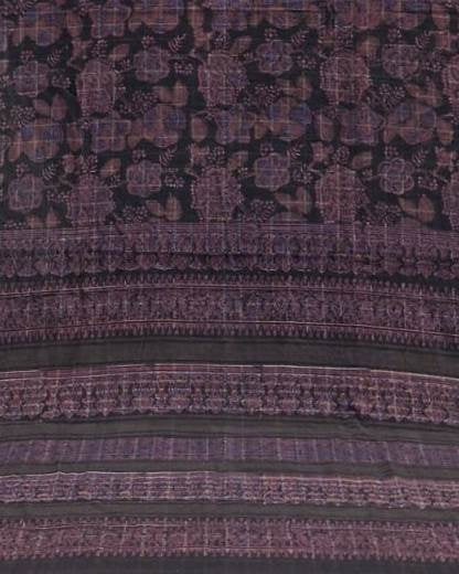 A close-up of a patterned textile or fabric with horizontal bands and ornate motifs in dark brown, burgundy, and muted purple tones.