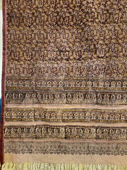 Textile with intricate patterns and designs on a brown background