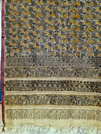 Decorative fabric with intricate patterns in black, gold, and white.