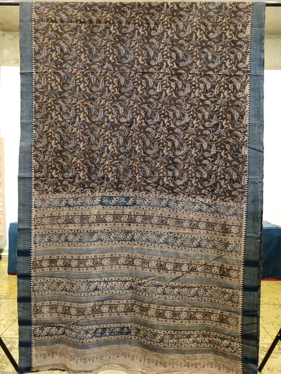 Decorative fabric with intricate patterns on a plain background