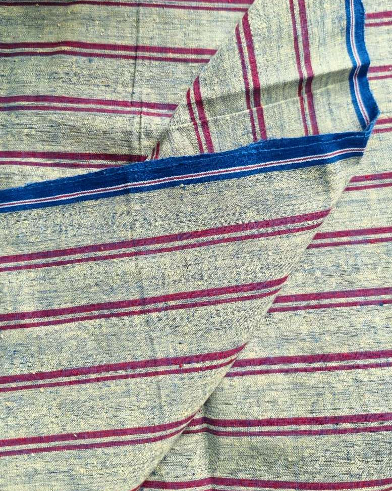 A close-up of a striped fabric with a heathered beige base, featuring horizontal magenta-pink stripes and a blue border.