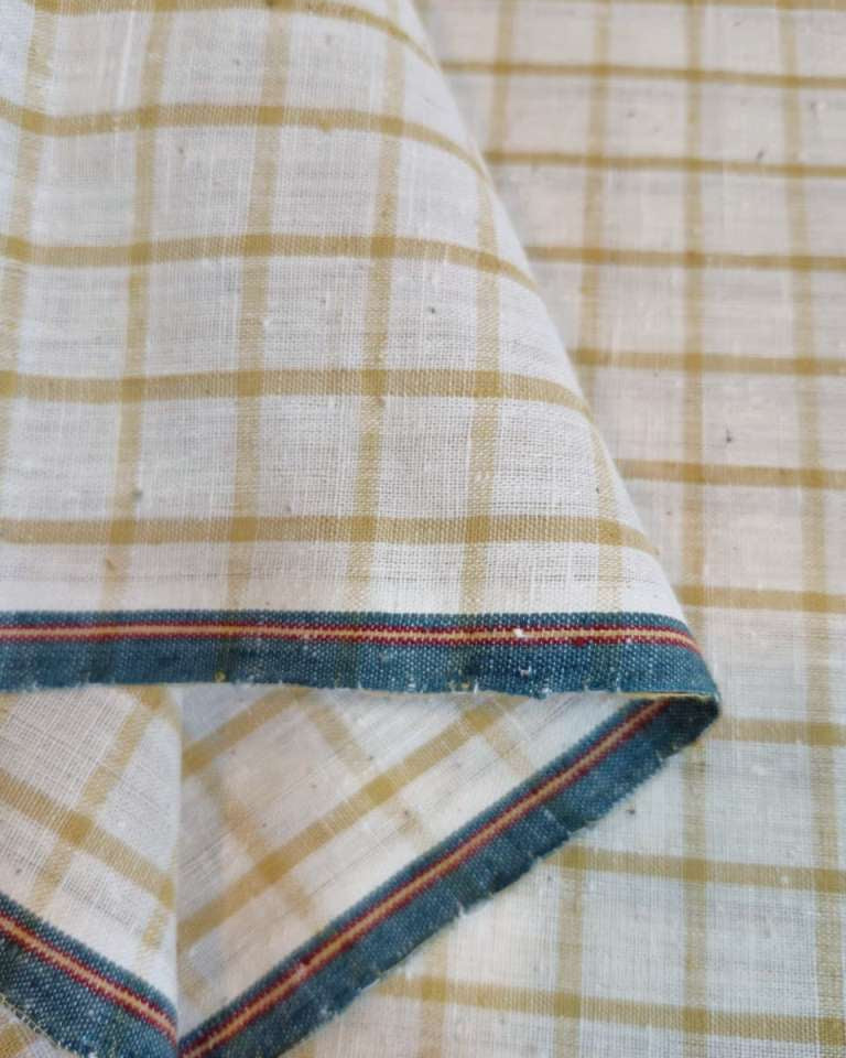 Close-up of checkered fabric with a visible seam