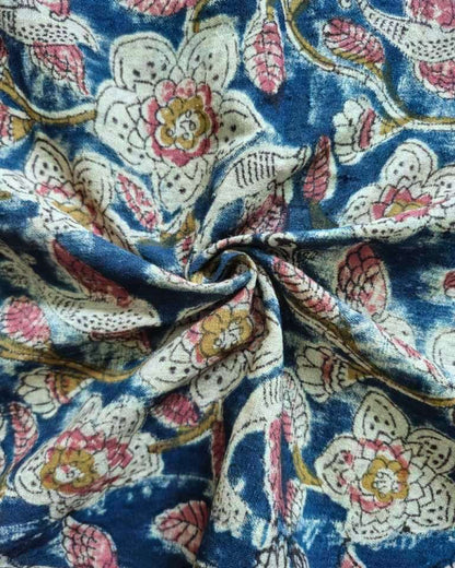 Close-up of floral patterned fabric with blue background